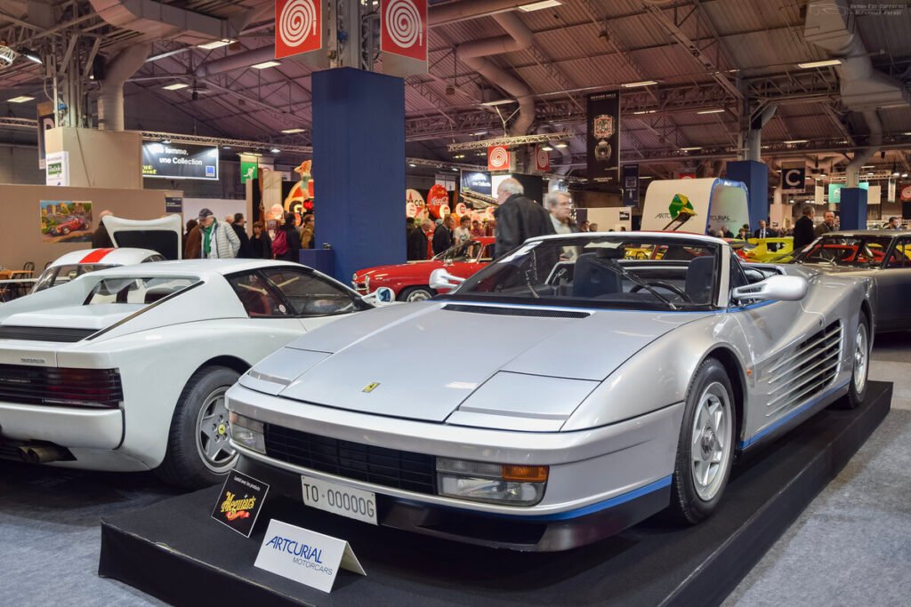 Silver Ferrari Testarossa Spider convertible at a classic car show