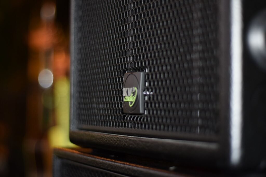 Close-up of the grille of a black KV2 Audio PA speaker