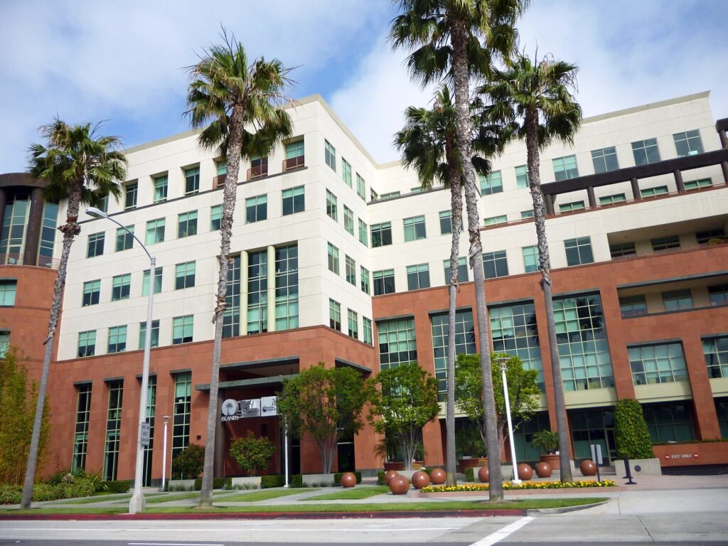 Universal Music Group's operational headquarters building with palm trees in Santa Monica, California